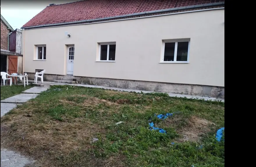 Façade après ITE — finition enduit beige